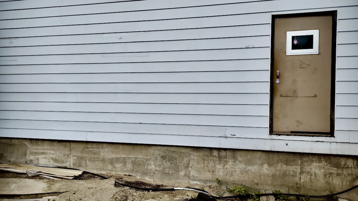 The old deck terrace and outdoor performance space at the Dyment Recreation Hall was pulled out this week. It's being replaced with a new, expanded area that will support outdoor concerts and community events for years to come. Photo: Terri Bell