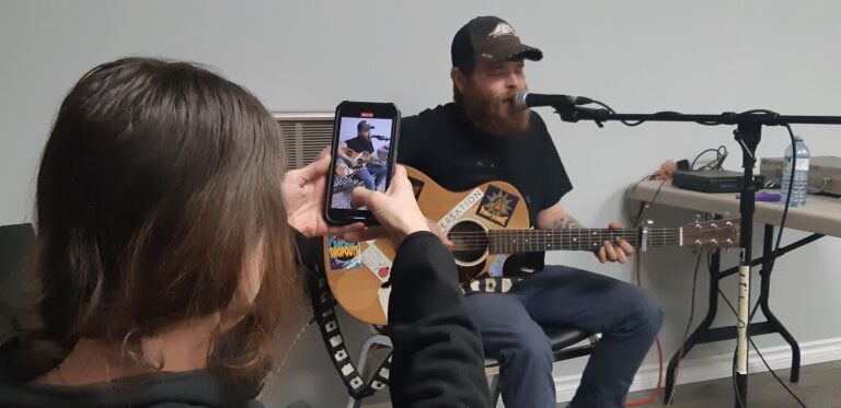Sean Merritt and Sara Fisher of the Birdfolk Buskers deliver a high-energy set to a packed house at Dyment Recreation Hall during the Family Day festivities.